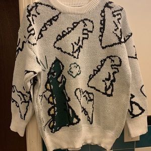 Sweater with dinosaur pattern